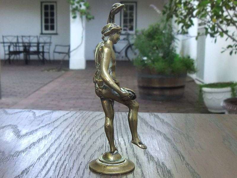 AN AWESOME OLD SOLID BRASS STATUE OF A ROMANESQUE FIGURE ...PERHAPS DANCING ...DETAILED PIECE !!
