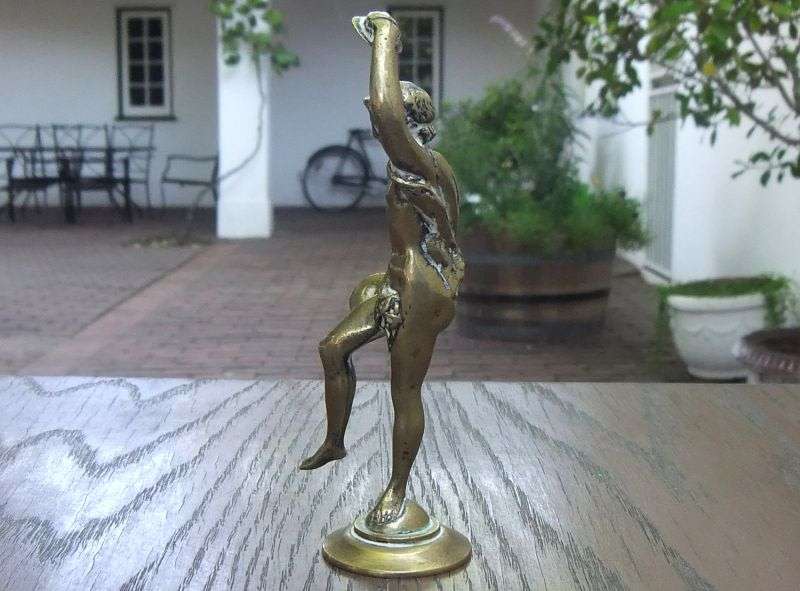 AN AWESOME OLD SOLID BRASS STATUE OF A ROMANESQUE FIGURE ...PERHAPS DANCING ...DETAILED PIECE !!
