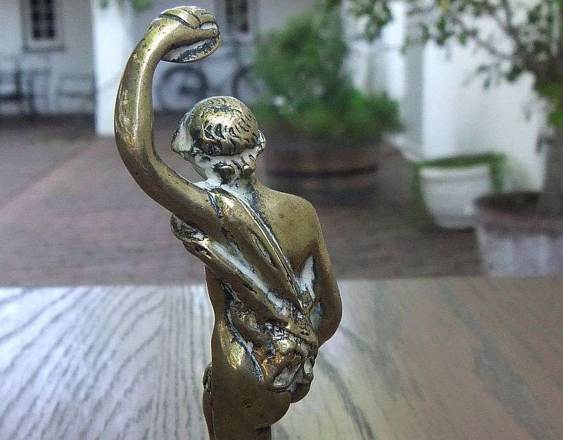 AN AWESOME OLD SOLID BRASS STATUE OF A ROMANESQUE FIGURE ...PERHAPS DANCING ...DETAILED PIECE !!