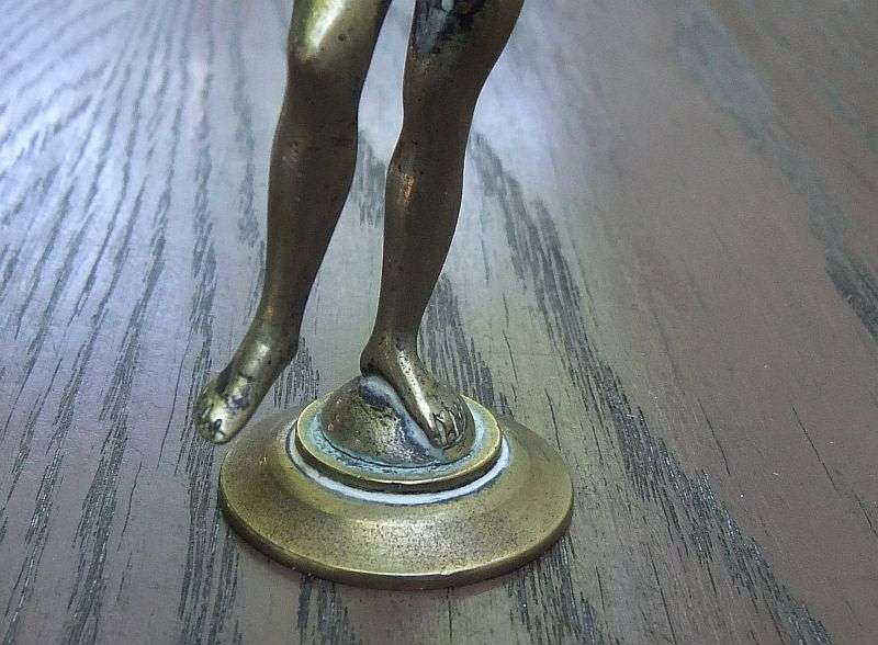 AN AWESOME OLD SOLID BRASS STATUE OF A ROMANESQUE FIGURE ...PERHAPS DANCING ...DETAILED PIECE !!
