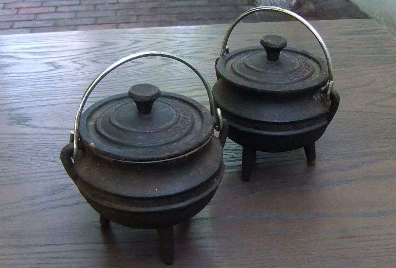 SO CUTE !! TWO BUSH BABY CAST IRON MINI "POTJIE KOS " POTS WITH LIDS AND HANDLES !! BID FOR BOTH !!