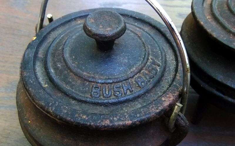 SO CUTE !! TWO BUSH BABY CAST IRON MINI "POTJIE KOS " POTS WITH LIDS AND HANDLES !! BID FOR BOTH !!