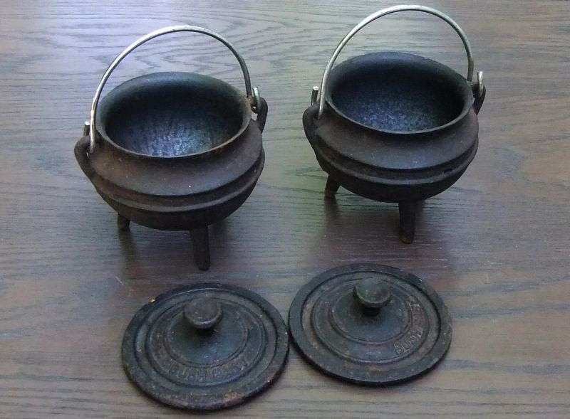 SO CUTE !! TWO BUSH BABY CAST IRON MINI "POTJIE KOS " POTS WITH LIDS AND HANDLES !! BID FOR BOTH !!
