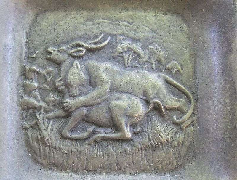 TRULY AFRICAN !! A VINTAGE BRASS ASHTRAY DEPICTING A LIONESS TAKING DOWN A BUCK