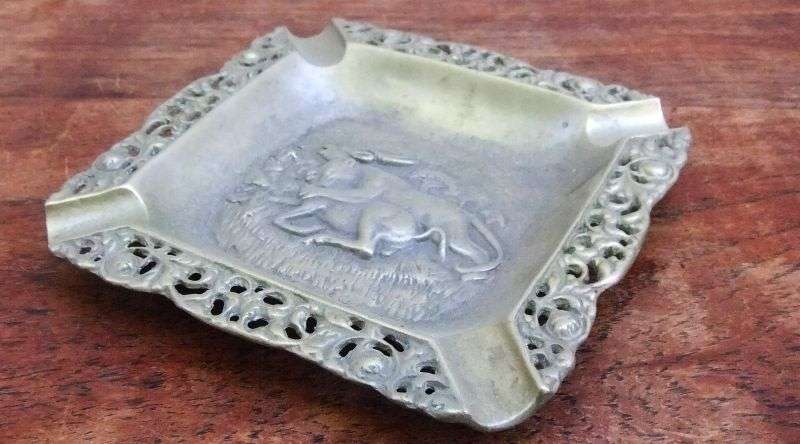 TRULY AFRICAN !! A VINTAGE BRASS ASHTRAY DEPICTING A LIONESS TAKING DOWN A BUCK