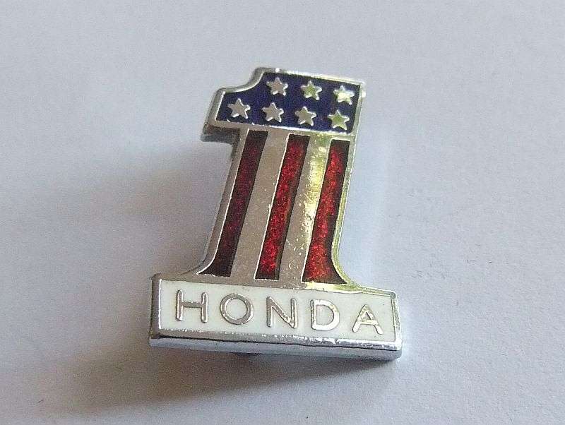 A VINTAGE ENAMEL AND METAL BIKER BADGE - HONDA