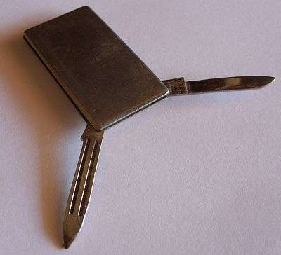 VINTAGE MONEY CLIP WITH KNIFE AND FILE