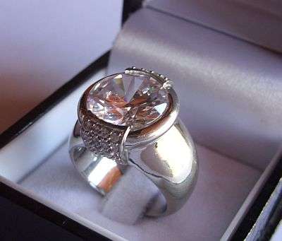 WHAT QUALITY !! THE HEAVIEST STERLING SILVER RING SET WITH AN AMAZING FACETED STONE