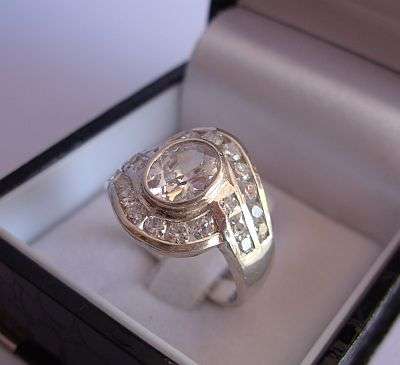 A FACETED CZ SET STERLING SILVER RING - TESTED