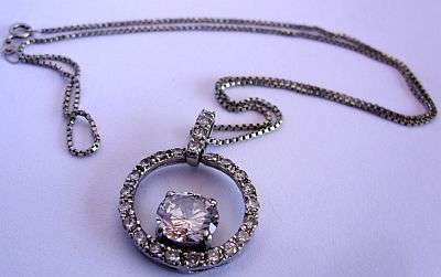 A MAGNIFICENT STERLING SILVER NECKLACE & PENDANT SET WITH FACETED CZ STONES