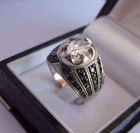 A MARVELOUS SOLID STERLING SILVER DESIGNER RING SET WITH AWESOME FACETED STONES