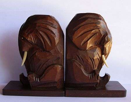 A VERY WELL CARVED PAIR OF ELEPHANT BOOKENDS WITH GENUINE BONE TUSKS