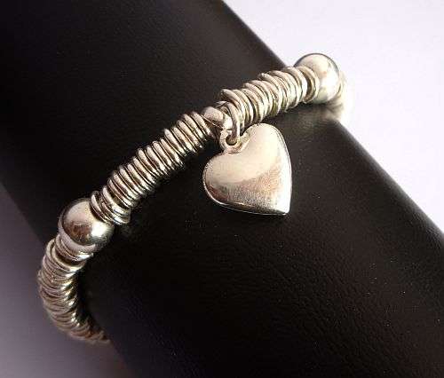 A STUNNING STERLING SILVER BRACELET WITH AN ADORABLE HEART CHARM - DESIGNER PIECE !!!!