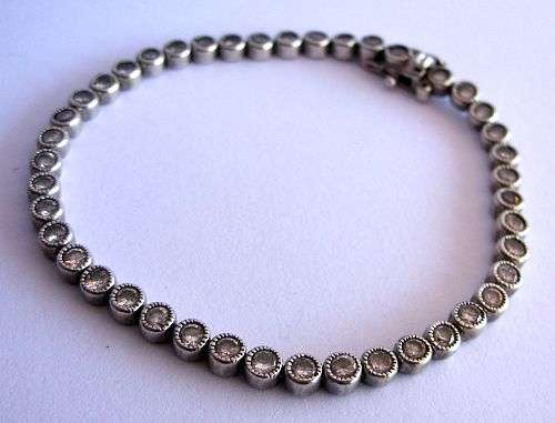 A SPLENDID SOLID STERLING SILVER TENNIS BRACELET SET WITH STYLISH FACETED CZ STONES !!!