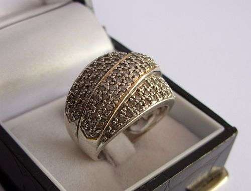 AN IMPRESSIVE SOLID STERLING SILVER RING MADE FOR AMERICAN SWISS !!! OVER 100 FACETED STONES !!!