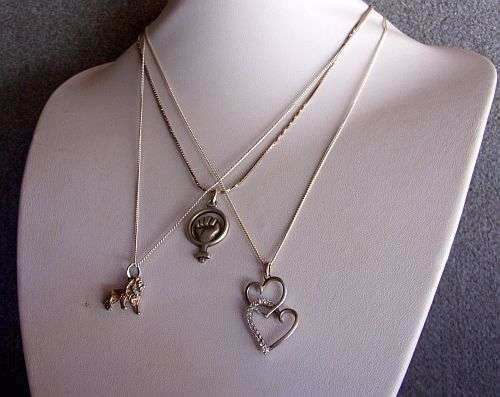 THREE SOLID STERLING SILVER NECKLACES WITH THREE EYE CATCHING STERLING SILVER PENDANTS !!!