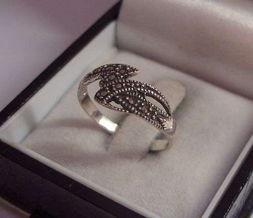 A CLASSY & DAINTY STERLING SILVER RING SET WITH MARCASITE !!!
