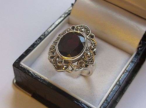 AN INCREDIBLE EYE CATCHING STERLING SILVER RING SET WITH A BIG BLOOD RED FACETED GARNET ! AWESOME !!
