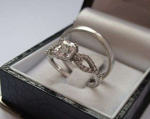 TWO STERLING SILVER RINGS !!! ONE CZ SET BEAUTY AND A PLAIN BAND !!! COOL PAIR !!!
