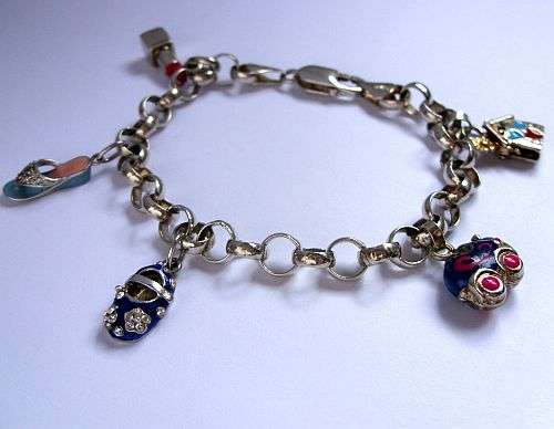AN AMAZING COLORFUL STERLING SILVER CHARM BRACELET WITH GIRLY CHARMS !!! MUST HAVE !!! WOW WOW WOW !