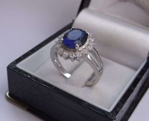 THE CHERRY ON TOP !! SUPER BEAUTIFUL STERLING SILVER RING SET WITH A FACETED BLUE STONE & CZ`S !!!!