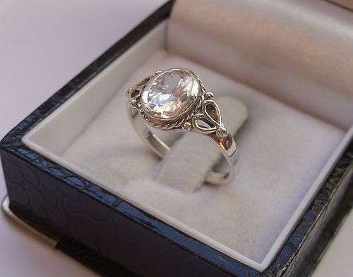 A SPLENDID STERLING SILVER RING WITH A FIRST RATE FACETED CLEAR STONE !!!!