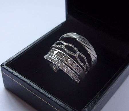 4 BEAUTIFUL SOLID STERLING SILVER RINGS WITH VARYING DESIGNS !!! GRAND LOT , ONE BID FOR ALL !!!!
