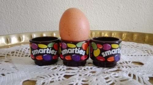 Hornsea Smarties Porcelain egg cups and a salt shaker in th form of an egg.