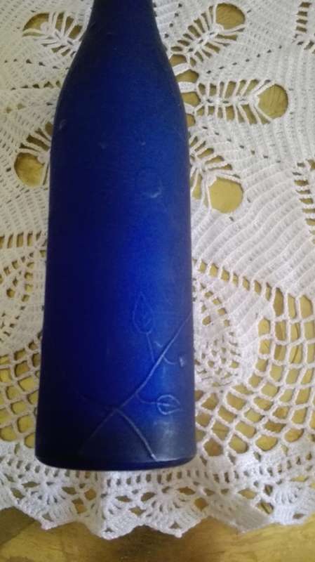 Frosted blue glass bottle
