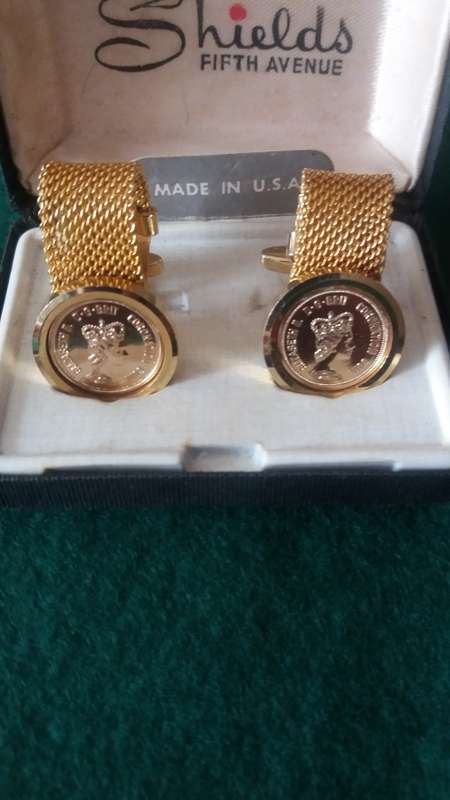 A Pair Of Gold Plated Elizabeth 11 Coronation Coin Cuff Links