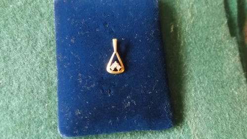 A Dainty 9ct Gold And CZ Pendant