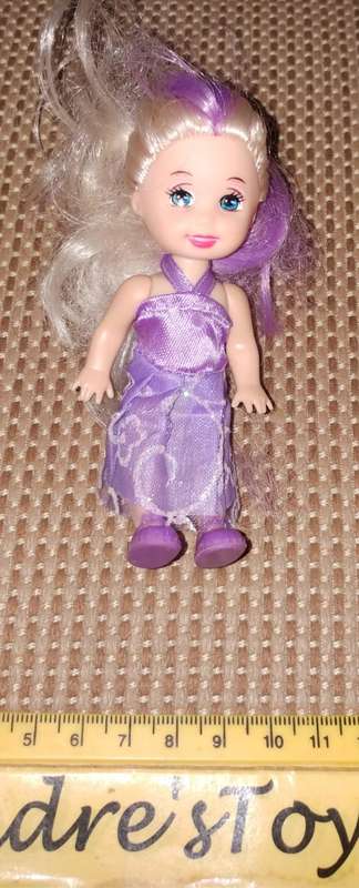 Miniature Doll in Purple Dress