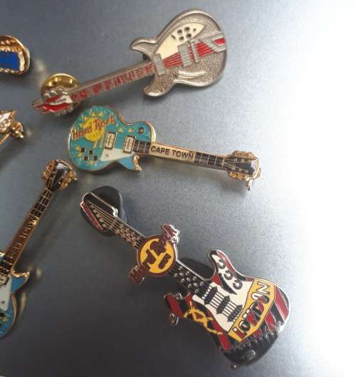 Hard Rock Cafe Guitar pins x 6 plus one other rock guitar