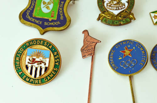 Rare Northern Rhodesia Olympic and Empire Games NOC badge plus selection of Rhodesian pin badges