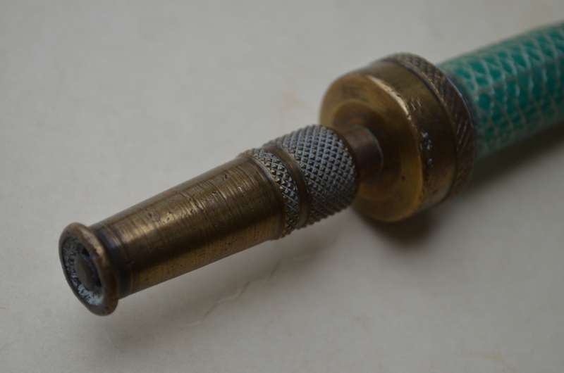 Brass antique hose pipe adjustable cone spray nozzle with the garden tap attachment. A nice prop.