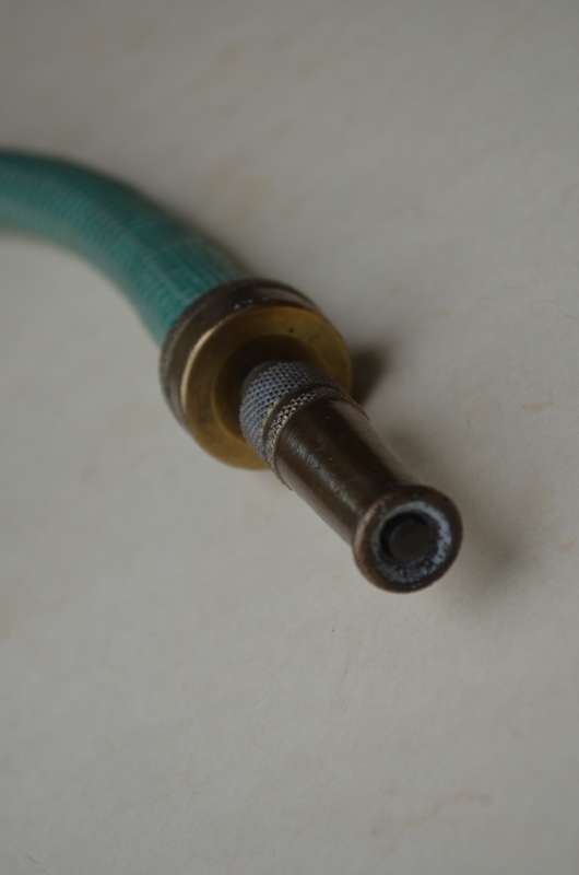 Brass antique hose pipe adjustable cone spray nozzle with the garden tap attachment. A nice prop.