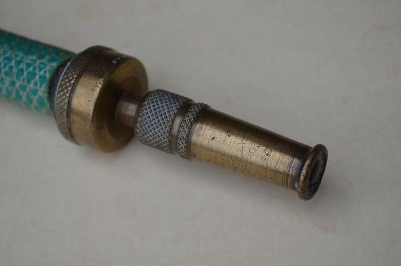 Brass antique hose pipe adjustable cone spray nozzle with the garden tap attachment. A nice prop.