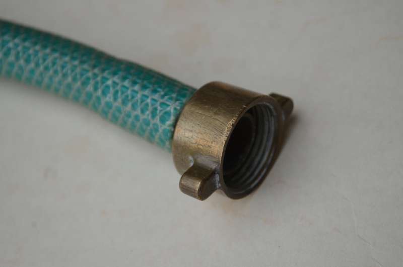 Brass antique hose pipe adjustable cone spray nozzle with the garden tap attachment. A nice prop.