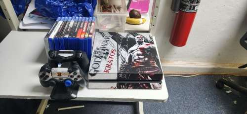 Playstation 4 500GB console with two dualshock controllers, playstation camera and 11 games