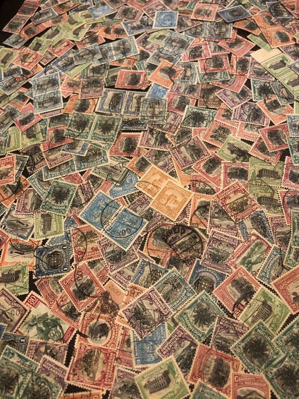 A COUPLE THOUSAND   MOZAMBIQUE   STAMPS OFF PAPER