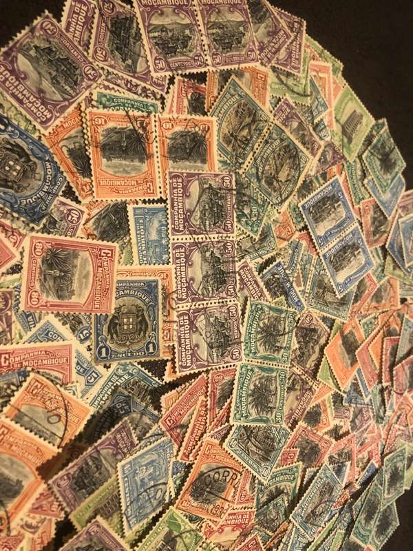 A COUPLE THOUSAND   MOZAMBIQUE   STAMPS OFF PAPER