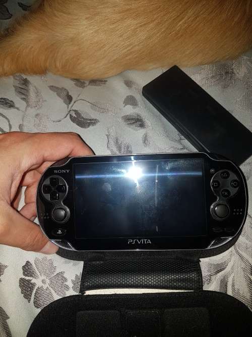 Basically new Ps Vita with 8 games and 4gb memory card.