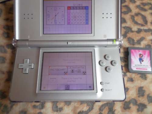 Nintendo DS Lite Silver *BOXED* With DS cover and with R4i + 7 Boxed games