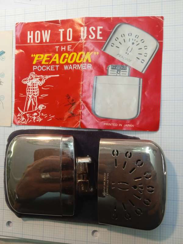 Vintage pocket warmer peacock with original pouch and instruction booklet