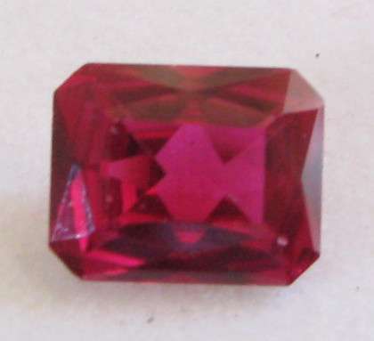 3.60ctw Wonderful Synthetic Dark Red Ruby, Emerald cut 10x7 mm.