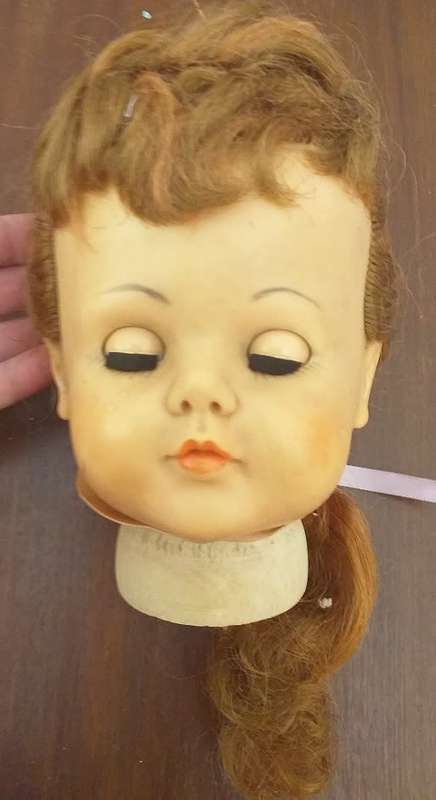 Antique doll head seems complete