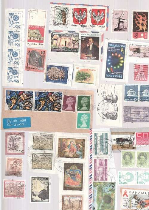 Stamp packet - lot of 100 + stamps see scans