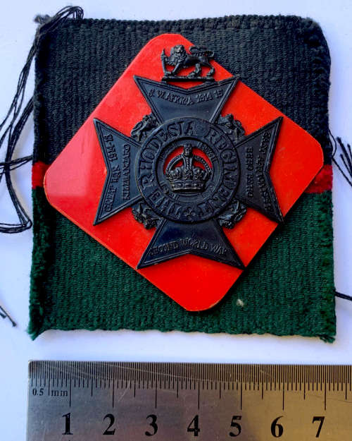 HS095 - Rhodesia Regiment badge on cloth Corps colours backing