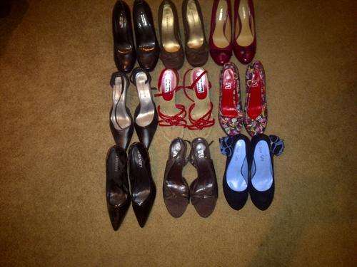 9 pairs of brand new size 6 ladies shoes from various retail stores.