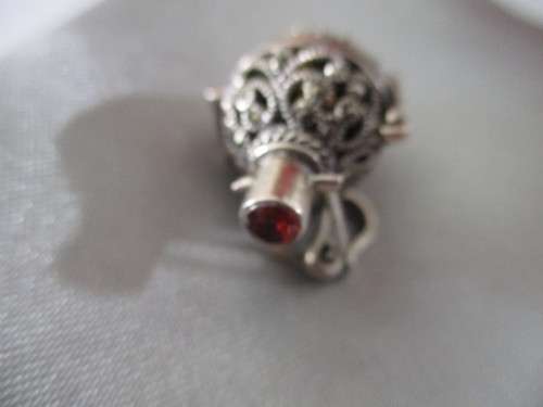 925 Sterling Silver and Garnet `Rattle` Pendant .